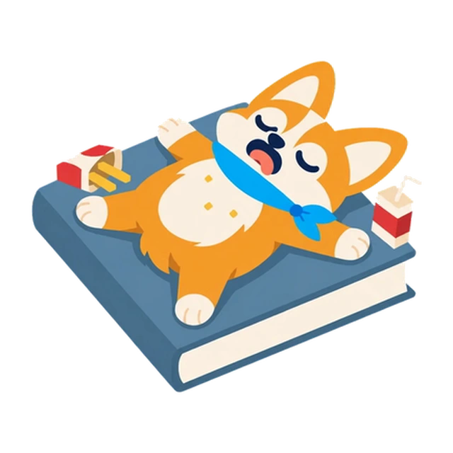 Pip the corgi taking a break on a big blue book.